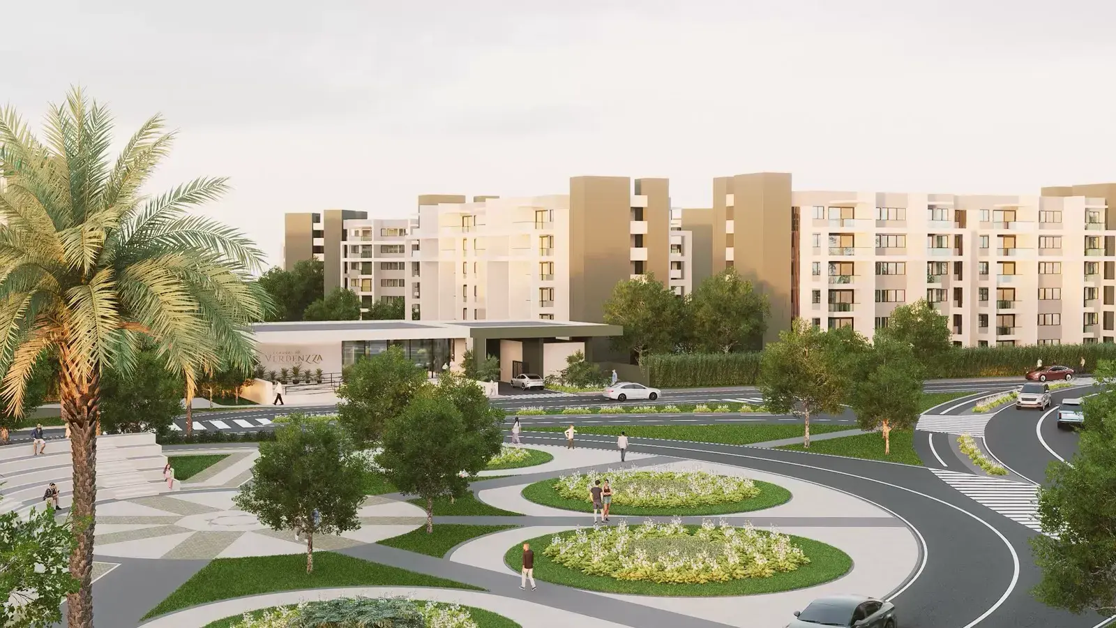 Plazoleta de llegada de Verdenzza con palmeras, jardines y las torres al fondo